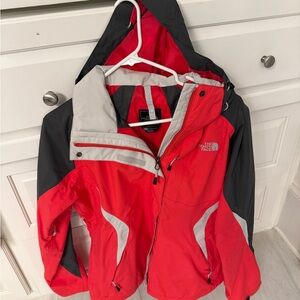 The North Face womens Vibrant Red and Charcoal Raincoat